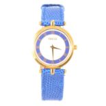 Gucci - a lady's gold-plated watch with blue chapter ring and strap, model 2000M.