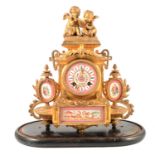 French gilt metal mantel clock with ceramic dial and plaques