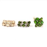 Two diamond and green stone rings and a diamond and possible chrome diopside cluster ring.