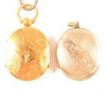 A three fold locket and chain and another oval locket.