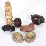 A carved bone figure, three netsukes and a carved pig, pair of white base metal boxes.