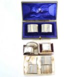 Pair of silver napkin rings, Wakely & Wheeler, London 1912, and seven others.