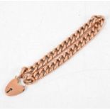A rose metal hollow curb link bracelet.