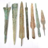 Four Bronze Age Luristan spearheads and three blades, all as found.