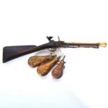 Antique flintlock blunderbuss and three powder flasks,