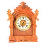 An Ansonia oak cased mantel clock, with strike.