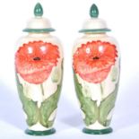 A pair of 'Poppy' design lustre covered vases by Lise B Moorcroft