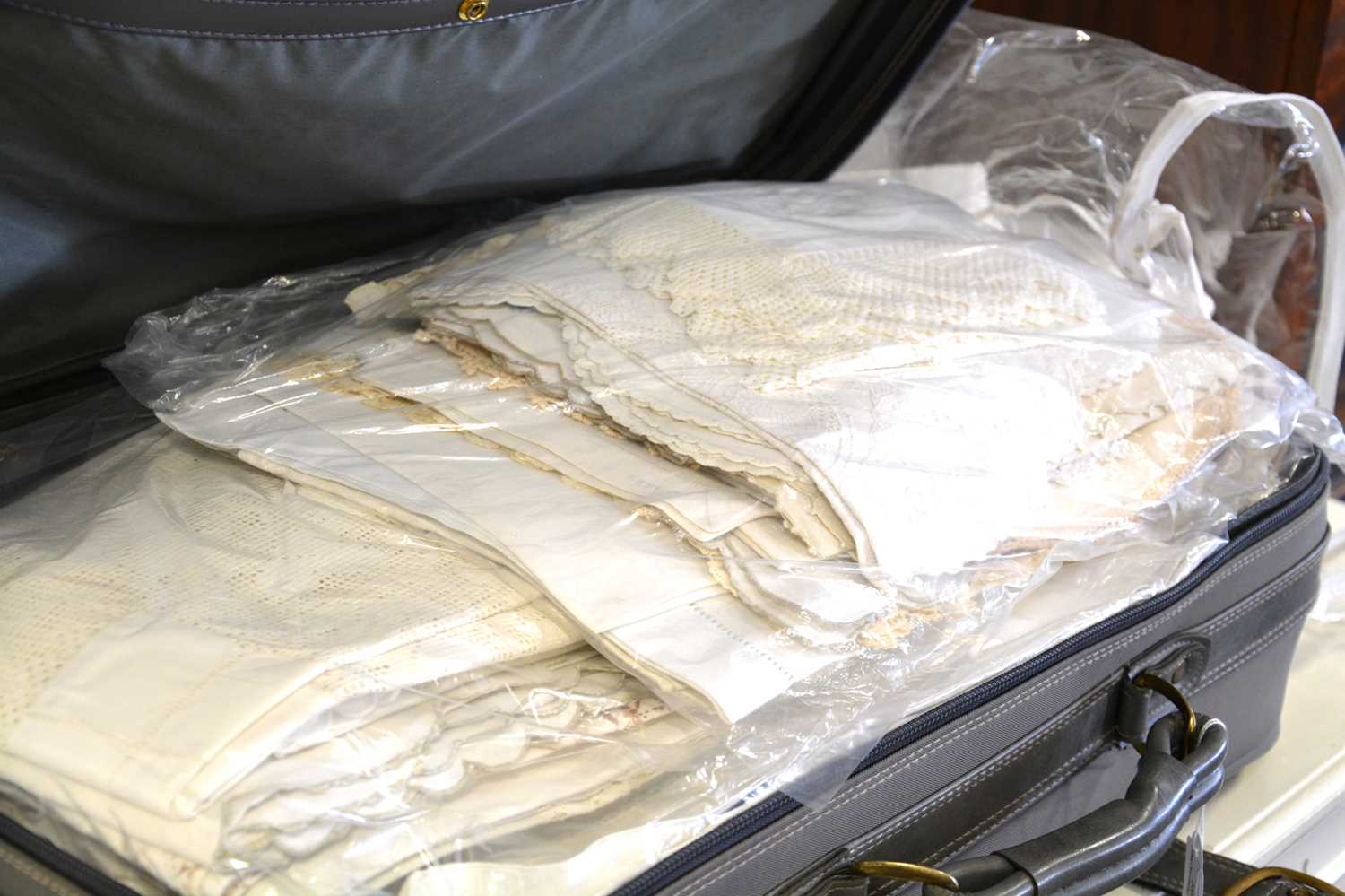 A suitcase of vintage linen.