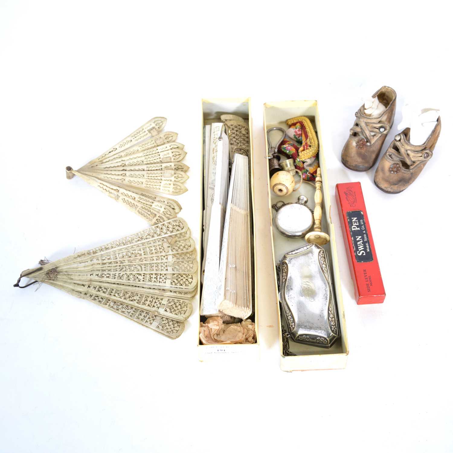 A collection of fans, pair of infants shoes, plated purse, beaded purse, bone cup and ball.