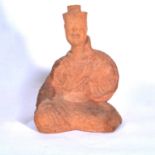 Han dynasty pottery figure of seated court attendant,