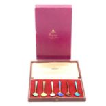 Set of six Harlequin silver gilt and enamelled coffee spoons, retailed by Asprey & Co