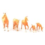Five Beswick models of palomino horses and foals.