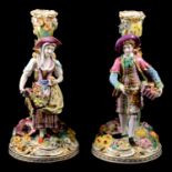 A pair Minton porcelain figural candlesticks, depicting Fruit and Flower sellers
