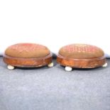 A pair of footstools, needlepoint upholstery,
