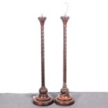 Pair of carved oak standard lamps,