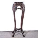 A Chinese carved hardwood jardiniere stand,