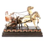 Resin sculpture of a Roman charioteer with chariot and two horses.