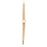 Omega - a lady's 9 cart yellow gold bracelet watch.