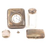 Nickel-plated 8 days pocket watch in silver mounted travelling case, and other silver items.