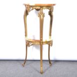 Brass and onyx two tier table; and a gilt framed pier glass