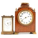 Brass carriage clock, and wooden mantel clock.