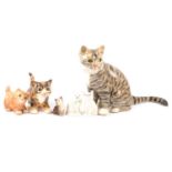Three Winstanley pottery cats, and three other cat figurines