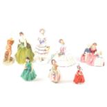 Collection of seven Doulton figurines, together with a Goebel figurine