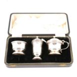 A cased silver three piece condiment set by J B Chatterley & Sons Ltd