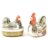 A pair of porcelain egg baskets in the form of roosting chickens