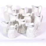 Nine large Portmeirion Porcelain British Heritage Collection parian jugs, and a large vase.