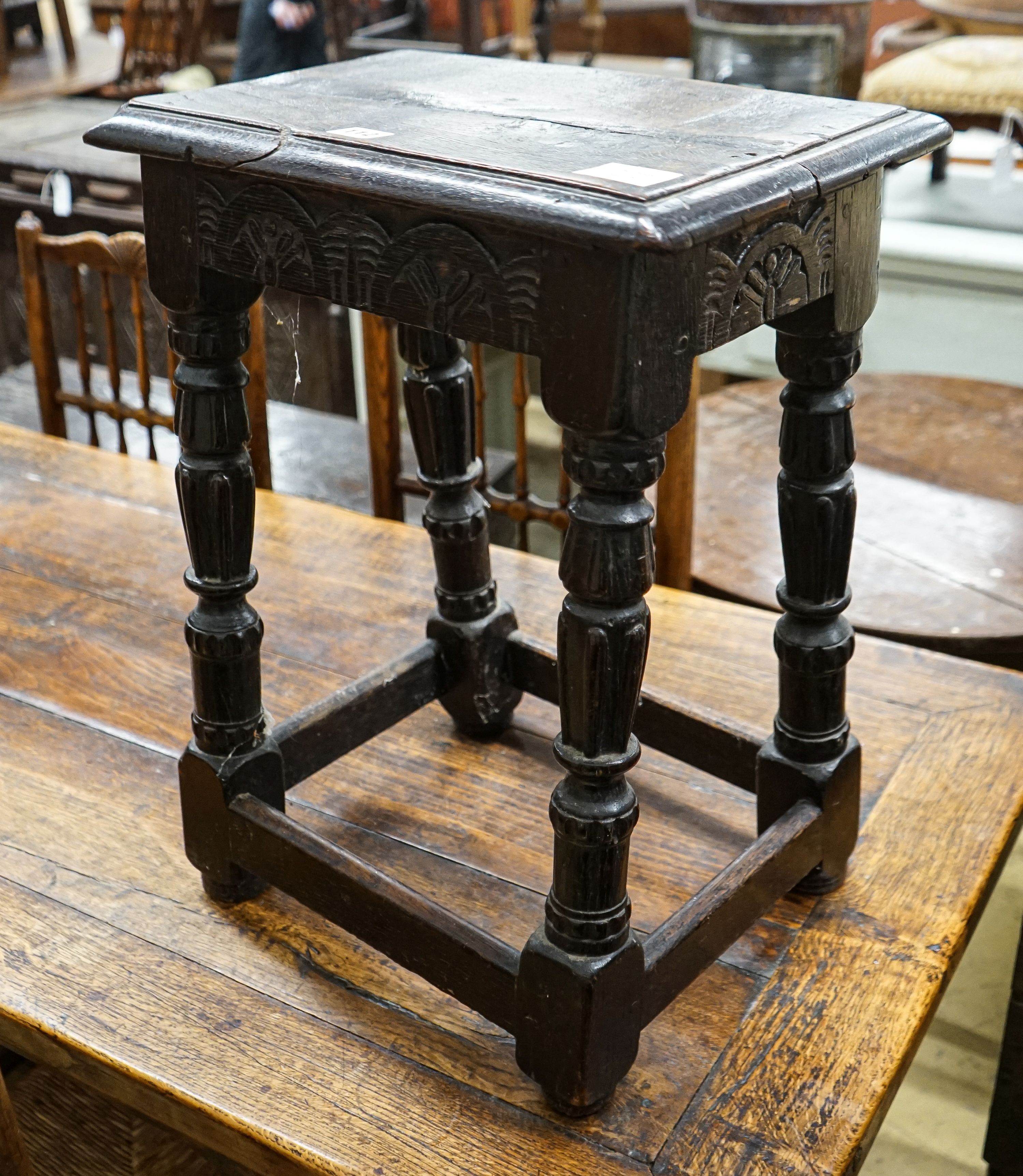 A late 18th century style stained oak joint stool, with turned and fluted legs, width 44cm, depth