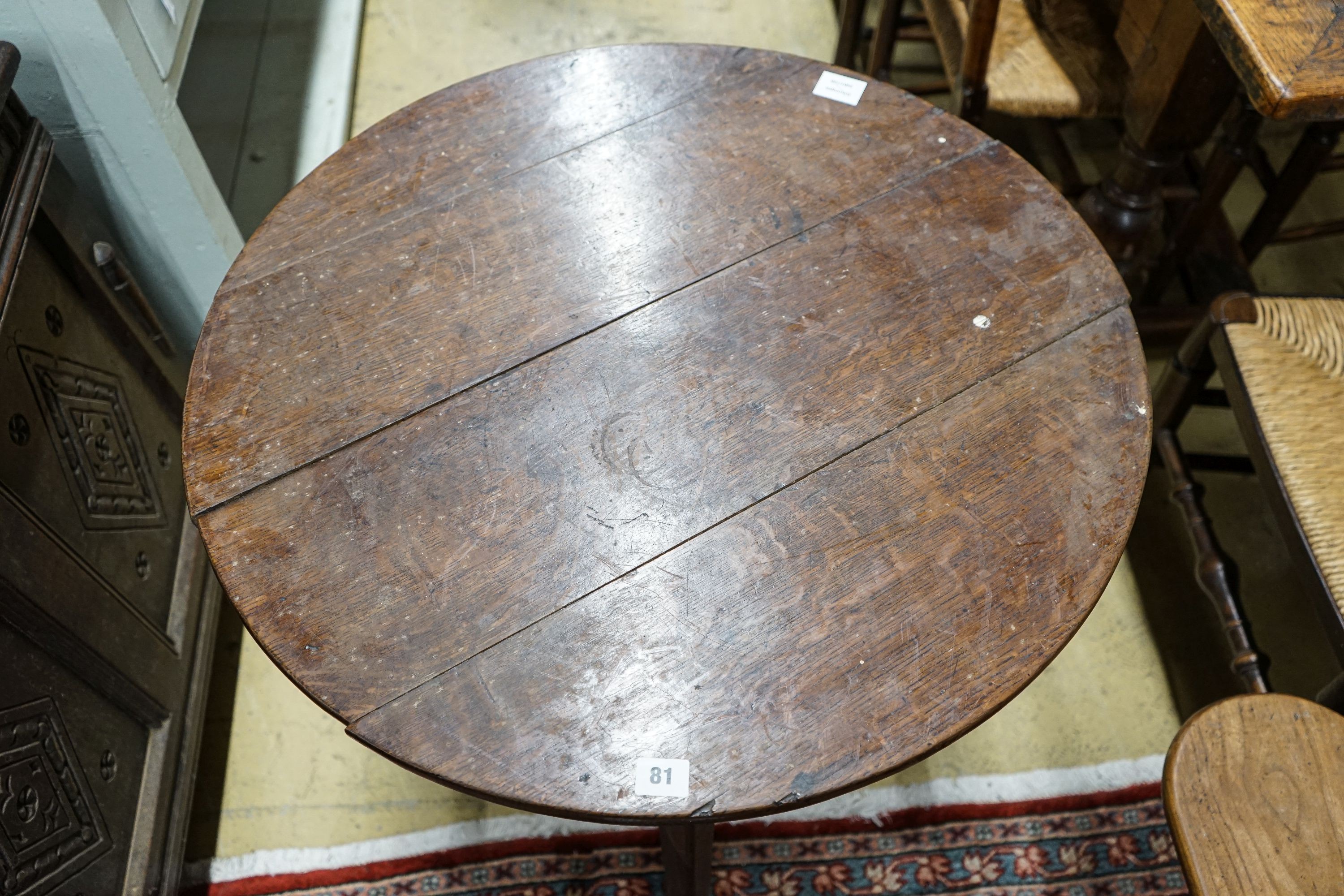 A George III oak cricket table, with circular top on tapered triangular legs, diameter 71cm height - Image 2 of 4