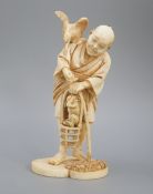 A Japanese ivory okimono of a cormorant fisherman, signed, Meiji period, 11cm and a small carving of