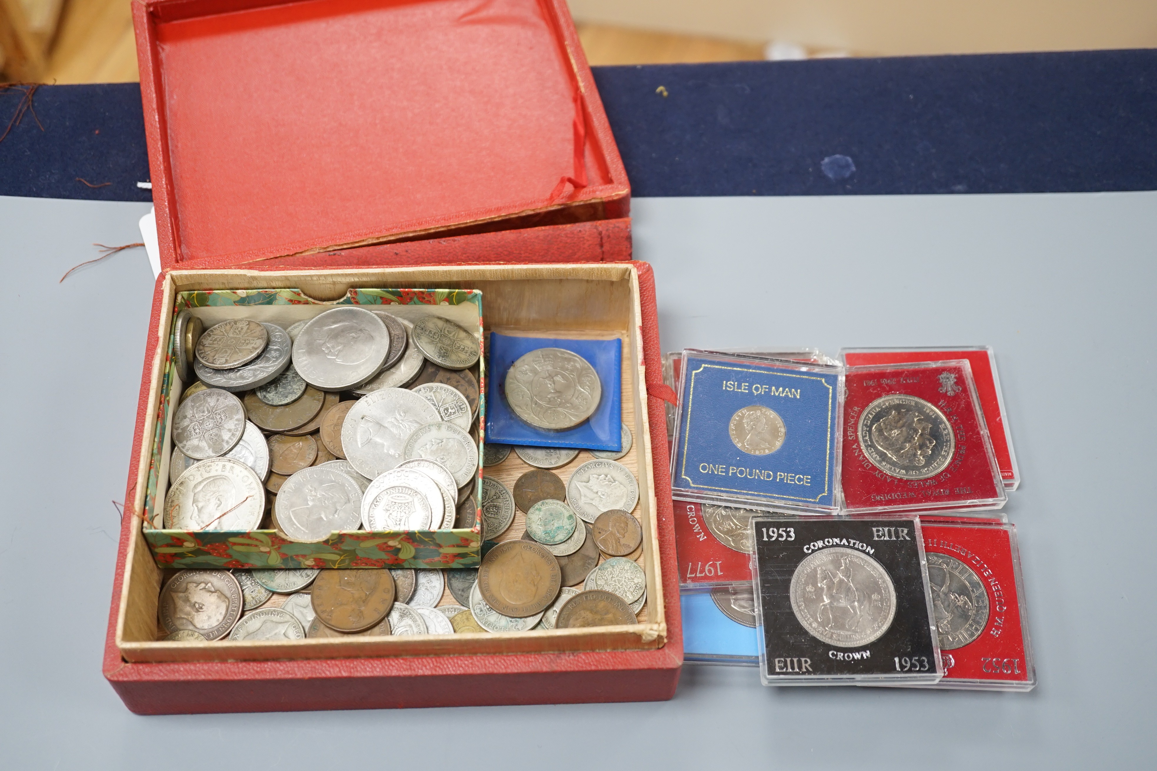 A collection of coins including a Victoria crown and two florins