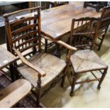 A harlequin set of five oak, elm and beech spindle back chairs, with rush seats and a similar