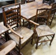 A harlequin set of five oak, elm and beech spindle back chairs, with rush seats and a similar