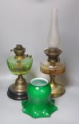 A brass green shade oil lamp and another oil lamp, 53cm