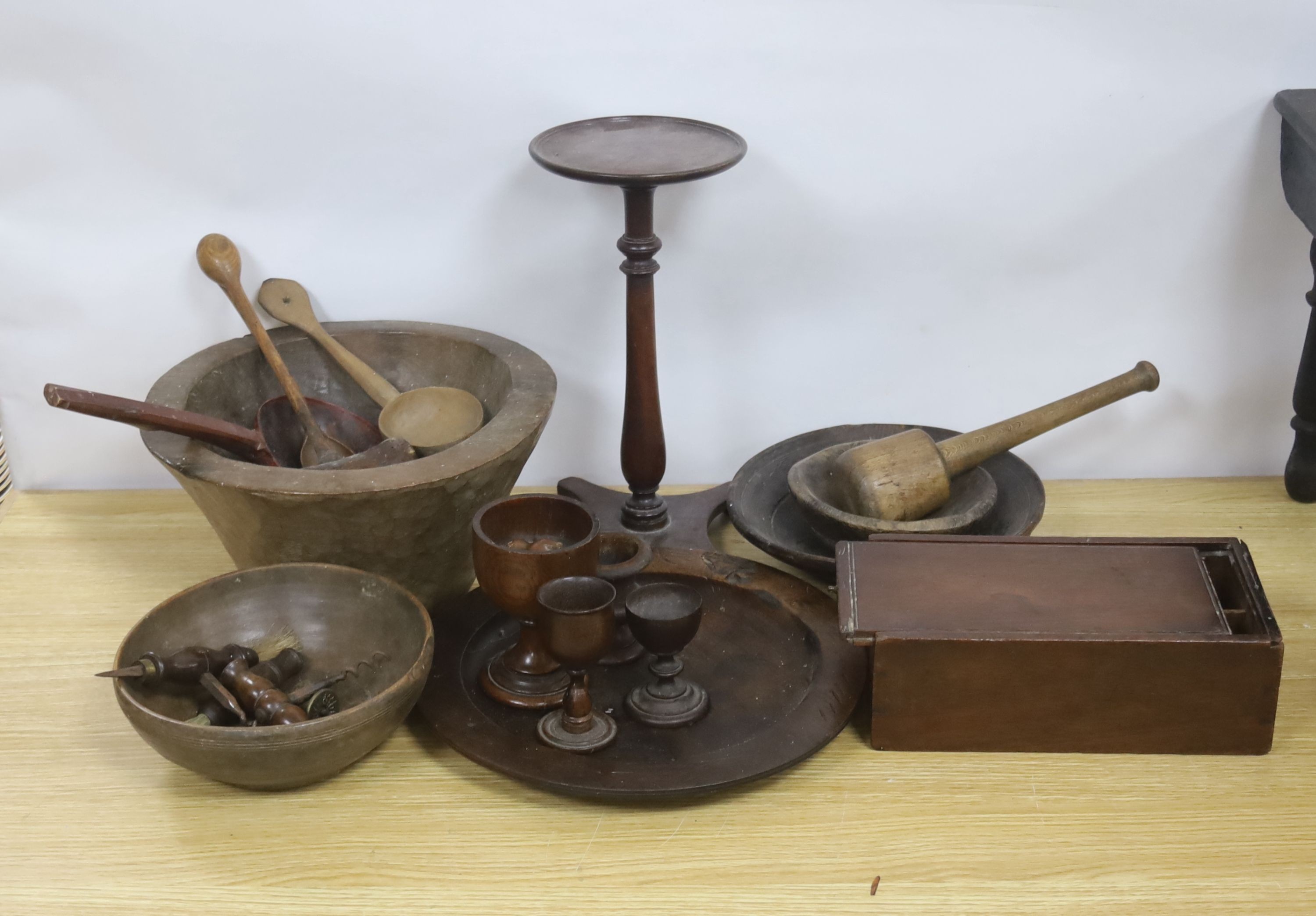 A group of assorted treen including an 18th century sliding lid mahogany box, a candle stand and