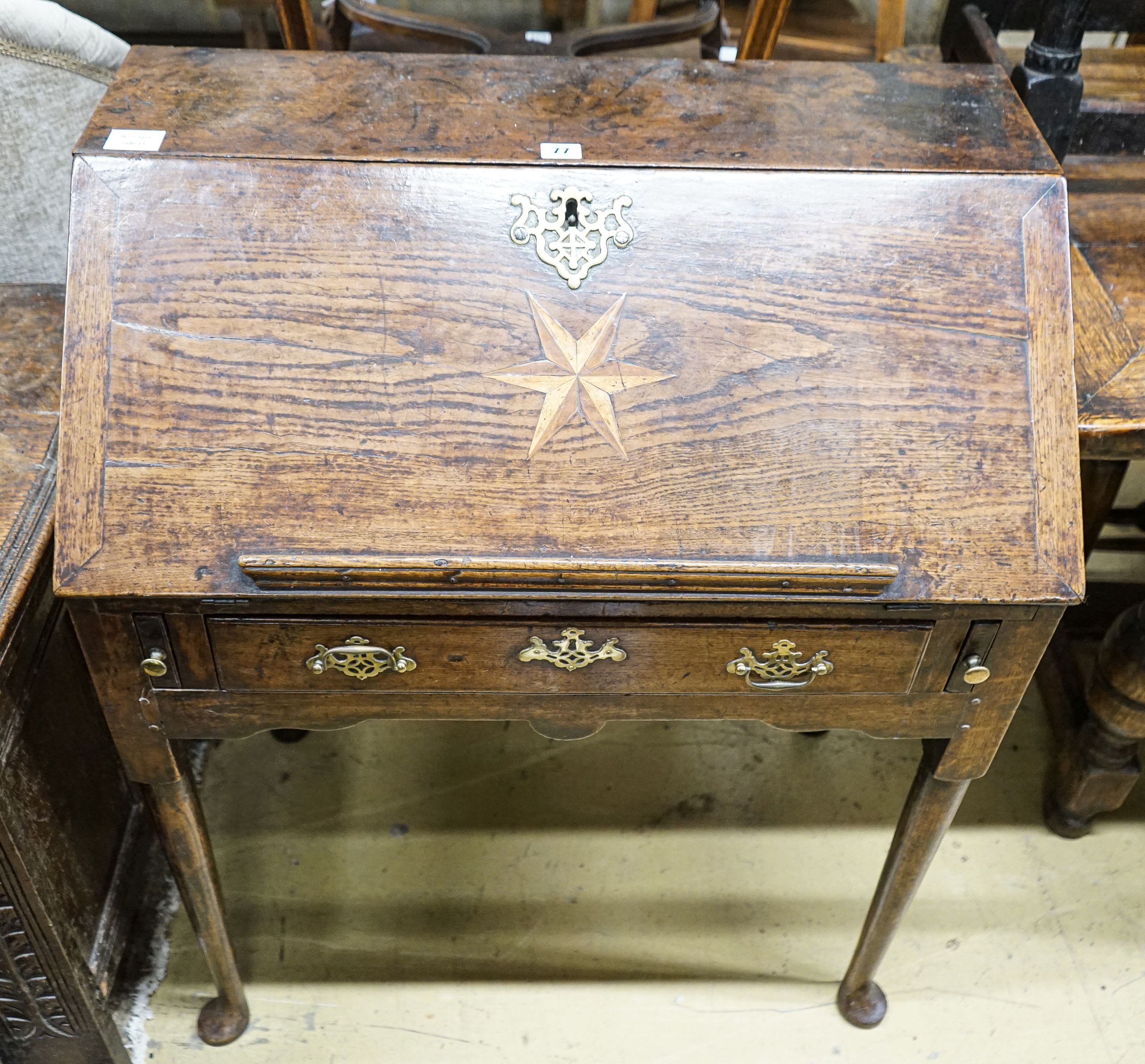 A mid 18th century inlaid oak and elm bureau, with fitted interior and single drawer, width 77cm,