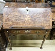 A mid 18th century inlaid oak and elm bureau, with fitted interior and single drawer, width 77cm,