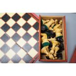 A wooden Staunton chess set and board