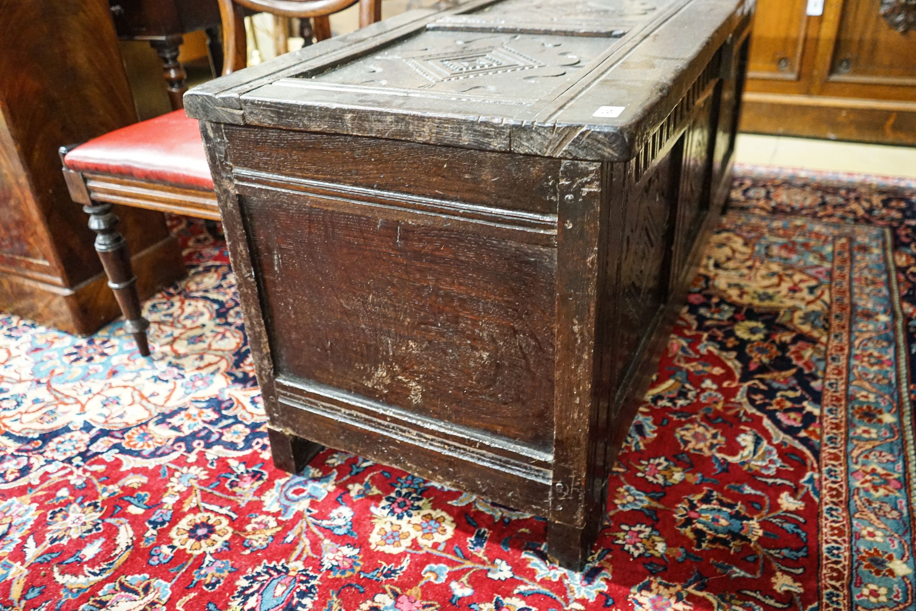 A late 17th/early 18th century carved and panelled oak coffer with hinged lid, width 136cm, depth - Image 2 of 7
