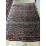 A North West Persian red ground carpet, 360 x 250cm