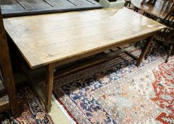 A Cotswold style oak and pine refectory table, with single pine drawer to one end, width 203cm,