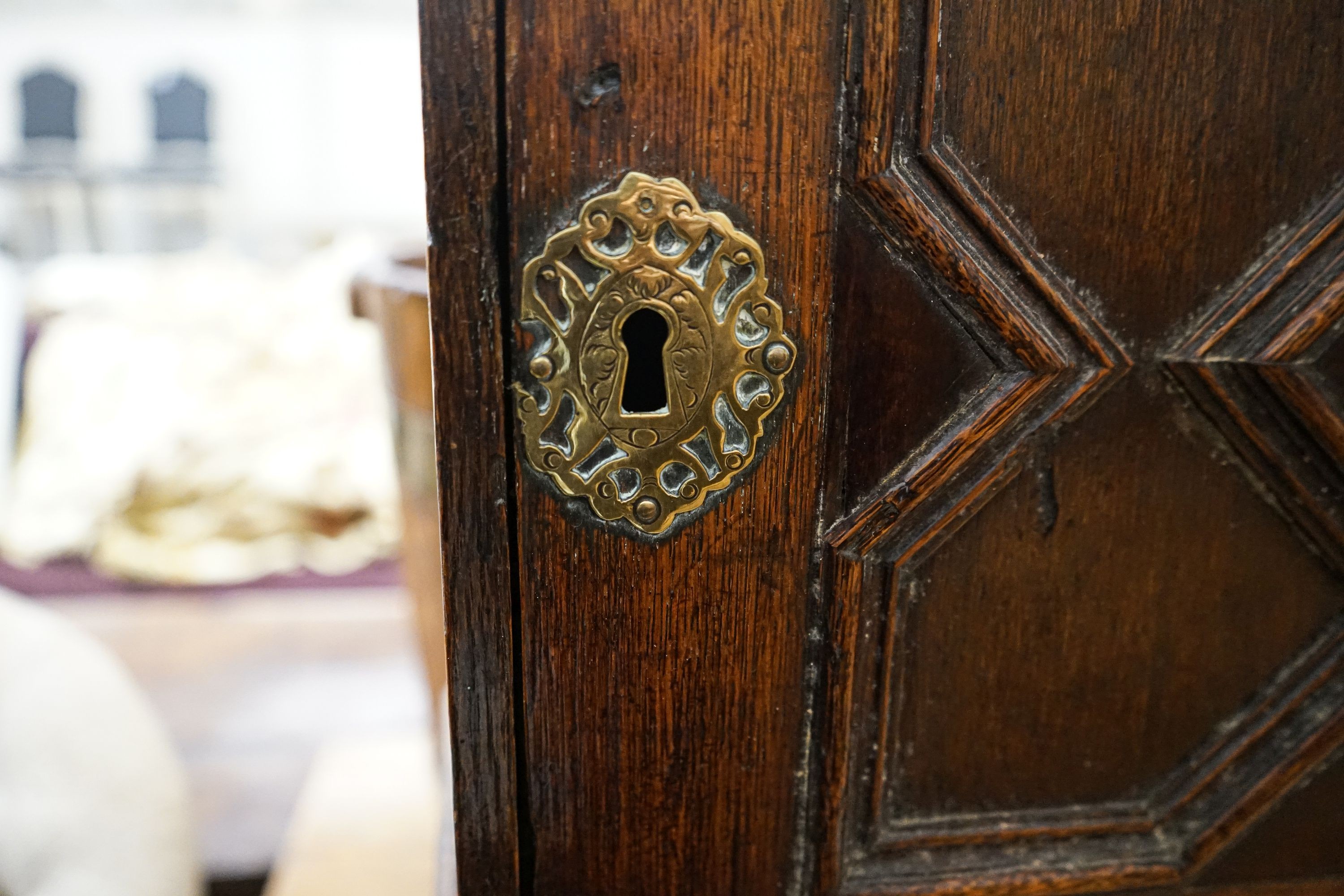 A late 17th century oak spice cupboard, with geometric panelled door enclosing five small drawers, - Image 5 of 6