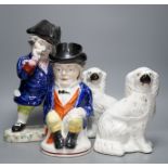 Two Staffordshire Toby jugs and a pair of Kings Charles Spaniel figures