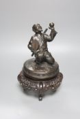 A Japanese bronze cover modelled as a samurai general, Meiji period, holding a fan and a ball,