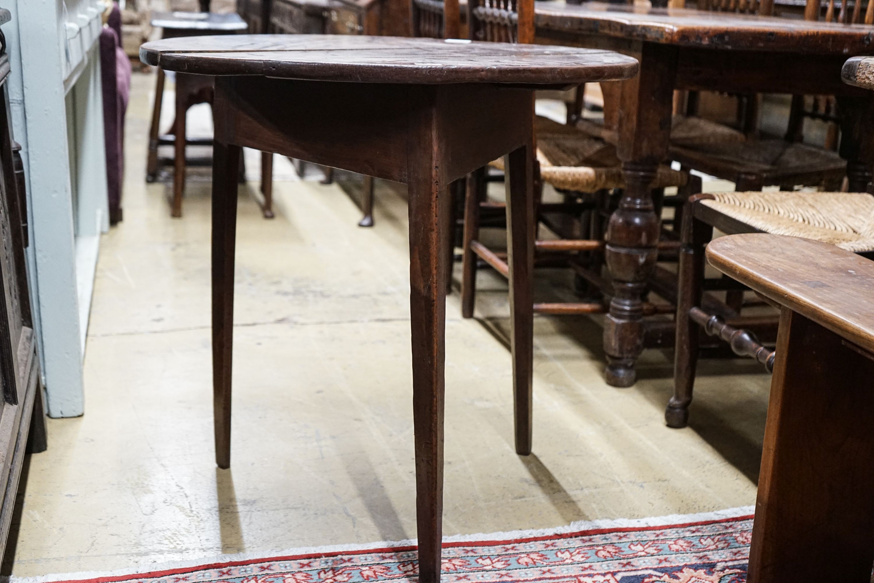 A George III oak cricket table, with circular top on tapered triangular legs, diameter 71cm height - Image 3 of 4