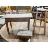 An 18th century oak low table, width 74cm, height 32cm, a carved oak foot stool and an Edwardian oak