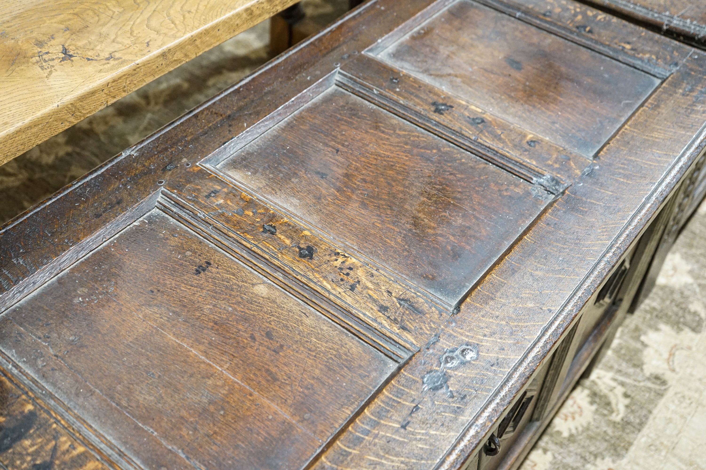 A late 17th century oak coffer, with four panel top and carved front, length 151cm, depth 58cm, - Image 2 of 6